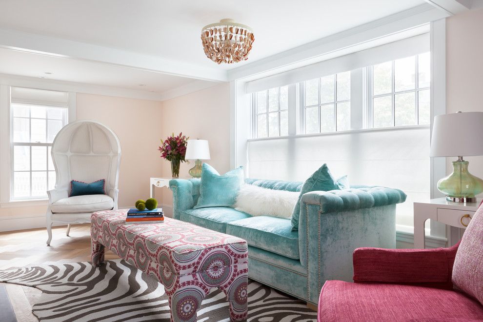 Design ideas for a nautical formal living room in Boston with pink walls and medium hardwood flooring.