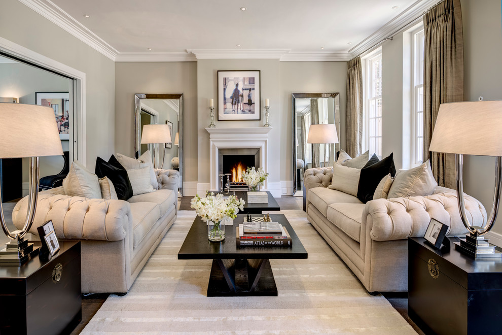 Design ideas for a traditional grey and cream living room in London with grey walls.