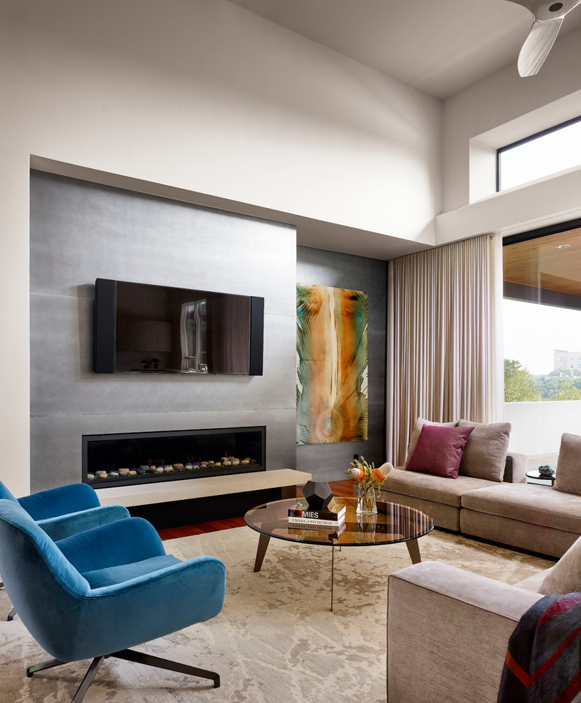 Inspiration for a contemporary living room remodel in Austin with white walls, a ribbon fireplace and a wall-mounted tv