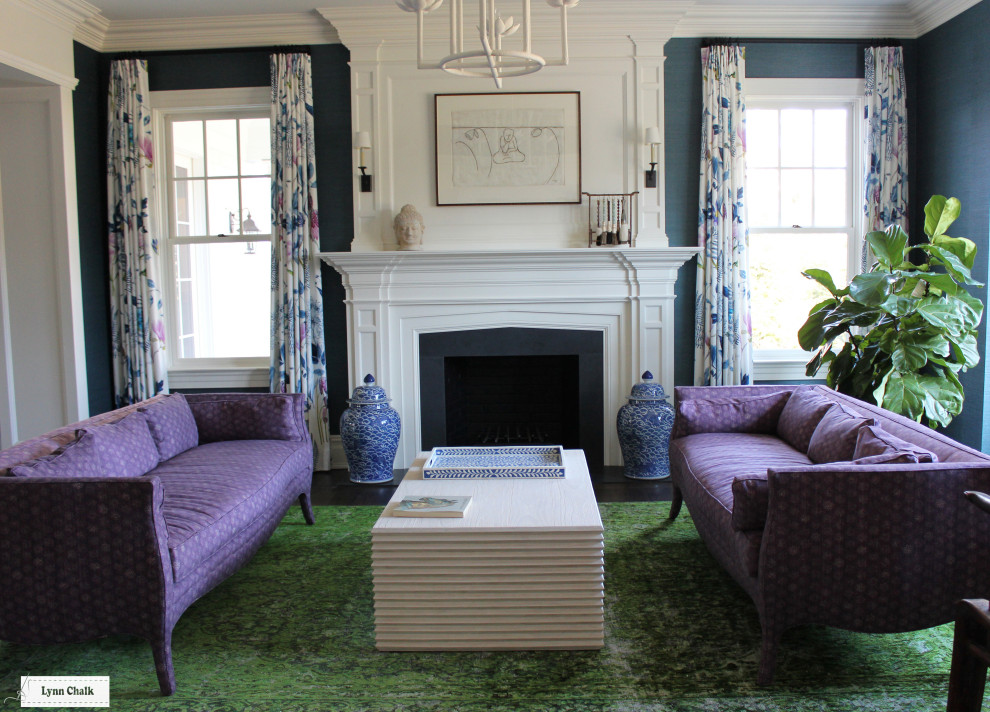 Photo of a medium sized modern living room in New York with blue walls, carpet, a standard fireplace and green floors.