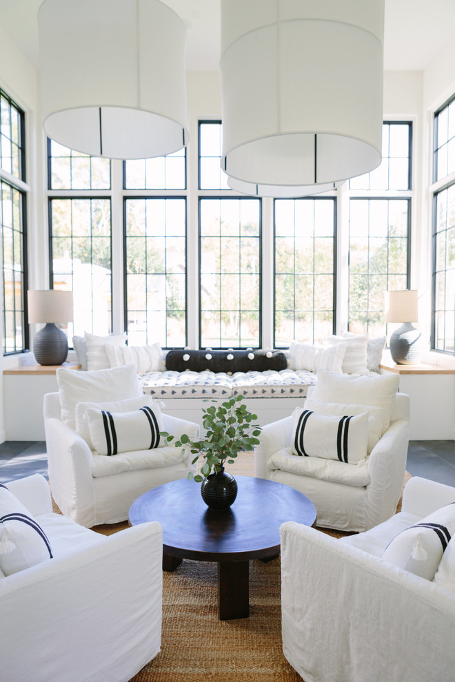Inspiration for a coastal gray floor living room remodel in Nashville with white walls