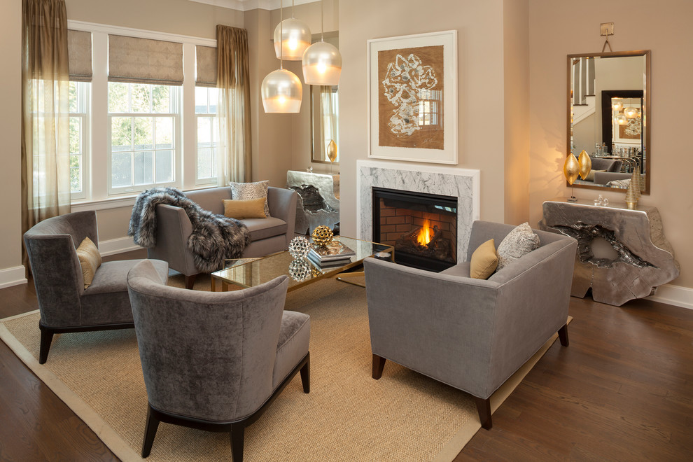 Inspiration for a traditional living room in New York with beige walls, dark hardwood flooring, a standard fireplace and brown floors.