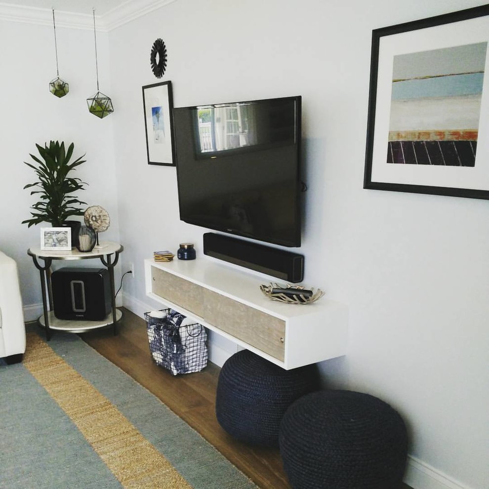 This is an example of a small contemporary open plan living room in Miami with blue walls, vinyl flooring, a wall mounted tv and no fireplace.