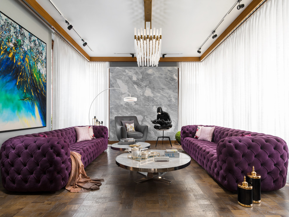 Immagine di un soggiorno design di medie dimensioni con pavimento in legno massello medio, pavimento marrone, sala formale e pareti grigie