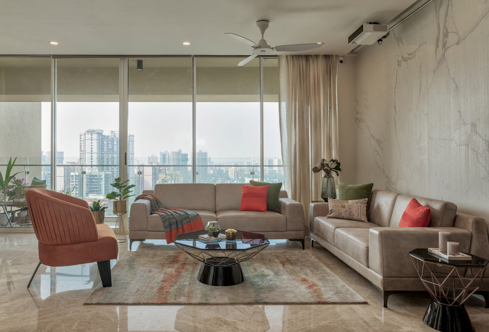 This is an example of a contemporary living room in Mumbai with beige walls and beige floors.