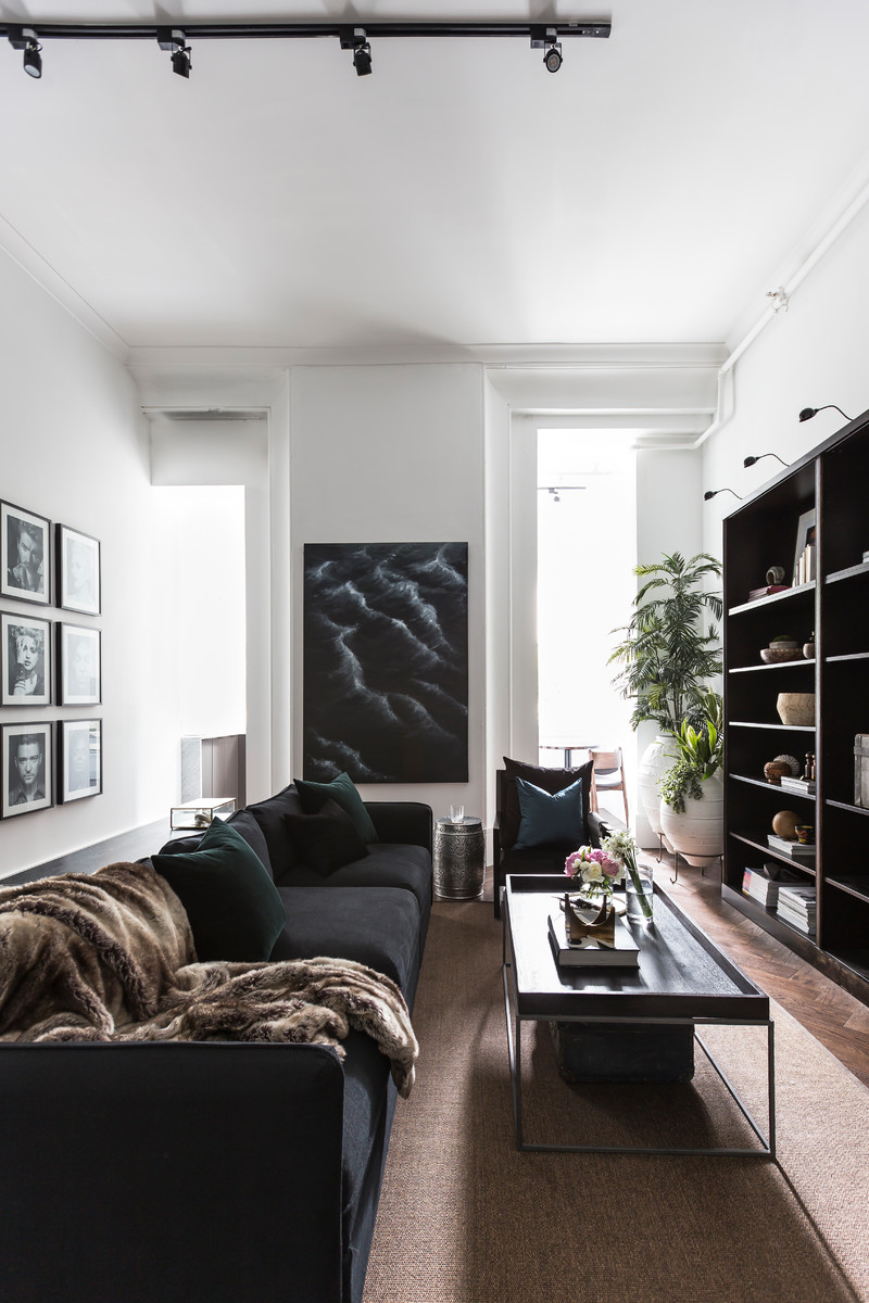 Inspiration for a small contemporary formal and open concept dark wood floor and brown floor living room remodel in Sydney with white walls, no fireplace and a tv stand