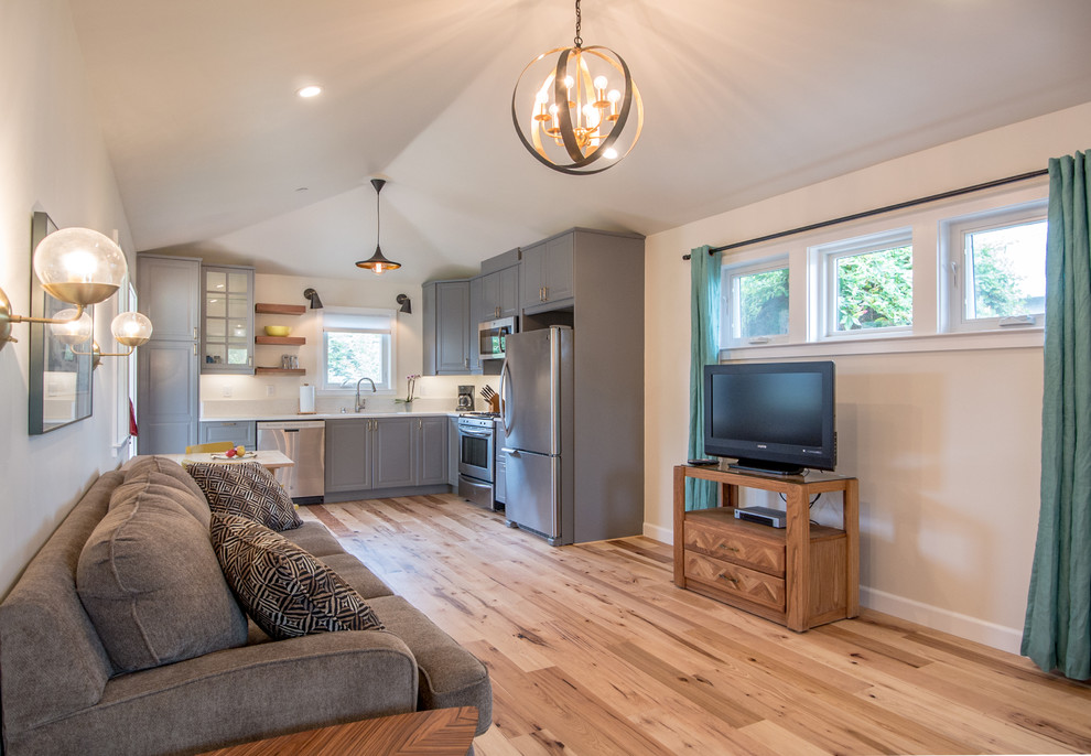 Photo of a small beach style open plan living room in San Francisco with medium hardwood flooring.