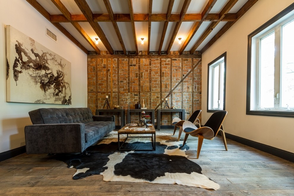 Inspiration for a contemporary open concept medium tone wood floor living room remodel in New York with white walls