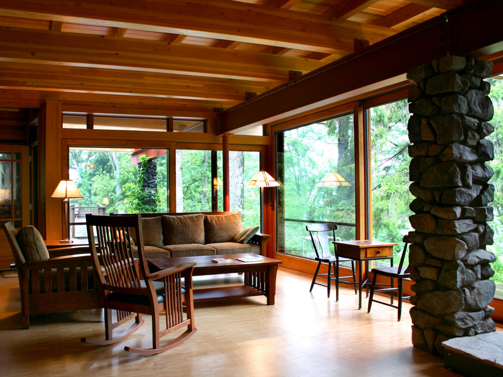 Medium sized traditional open plan living room in Minneapolis with light hardwood flooring.