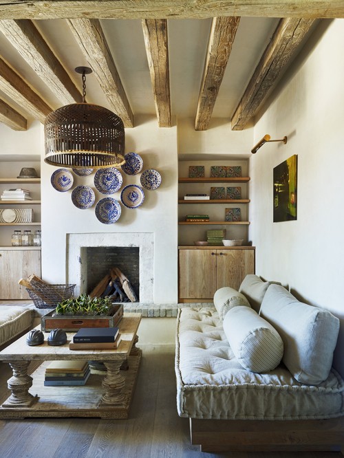 rustic and modern living room featuring exposed wooden beams