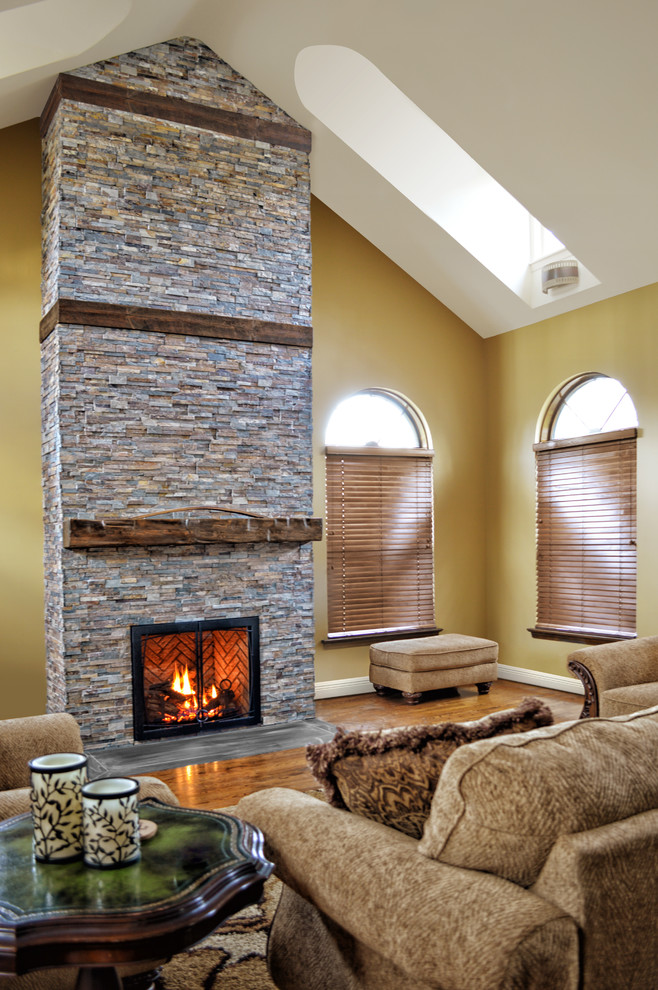 rustic fireplace in a room with high ceilings Traditional Living