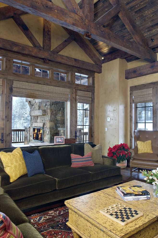 This is an example of a rustic living room in Other with beige walls.