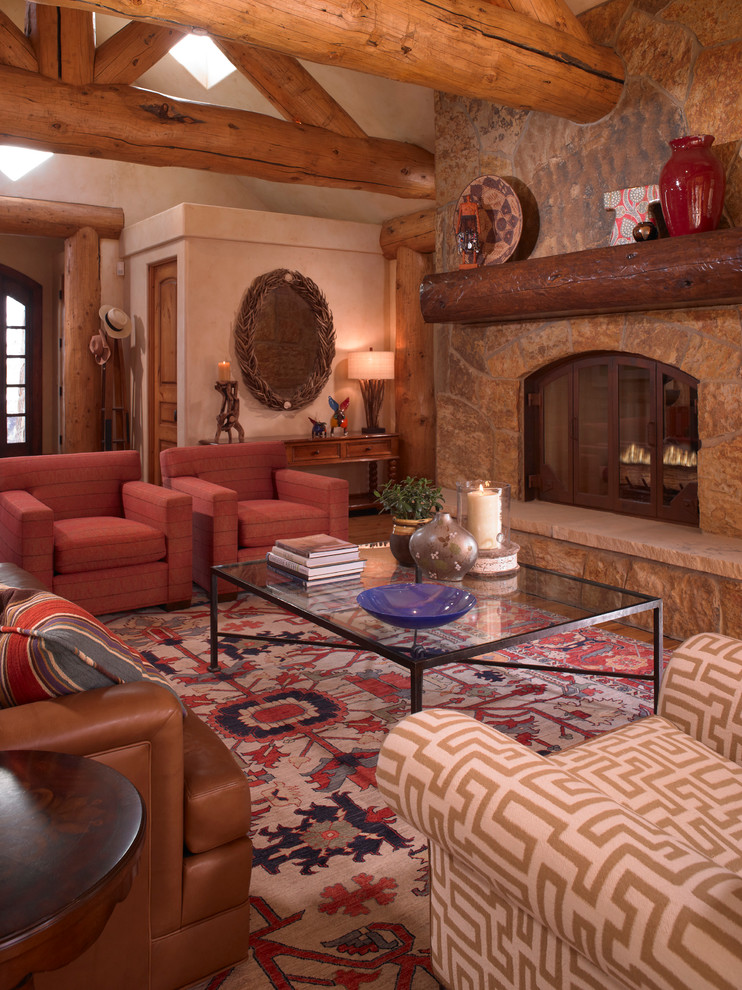 Design ideas for a large rustic formal mezzanine living room in Denver with beige walls, carpet, a standard fireplace, a stone fireplace surround, no tv and multi-coloured floors.