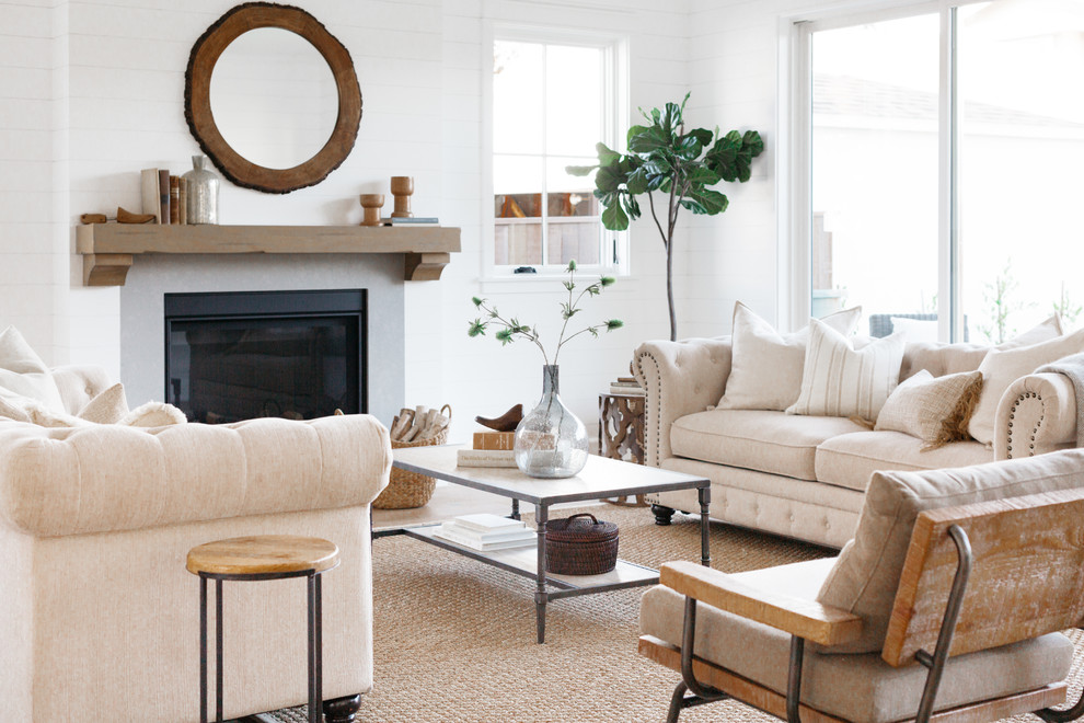 Design ideas for a farmhouse open plan living room in Los Angeles with white walls and a standard fireplace.