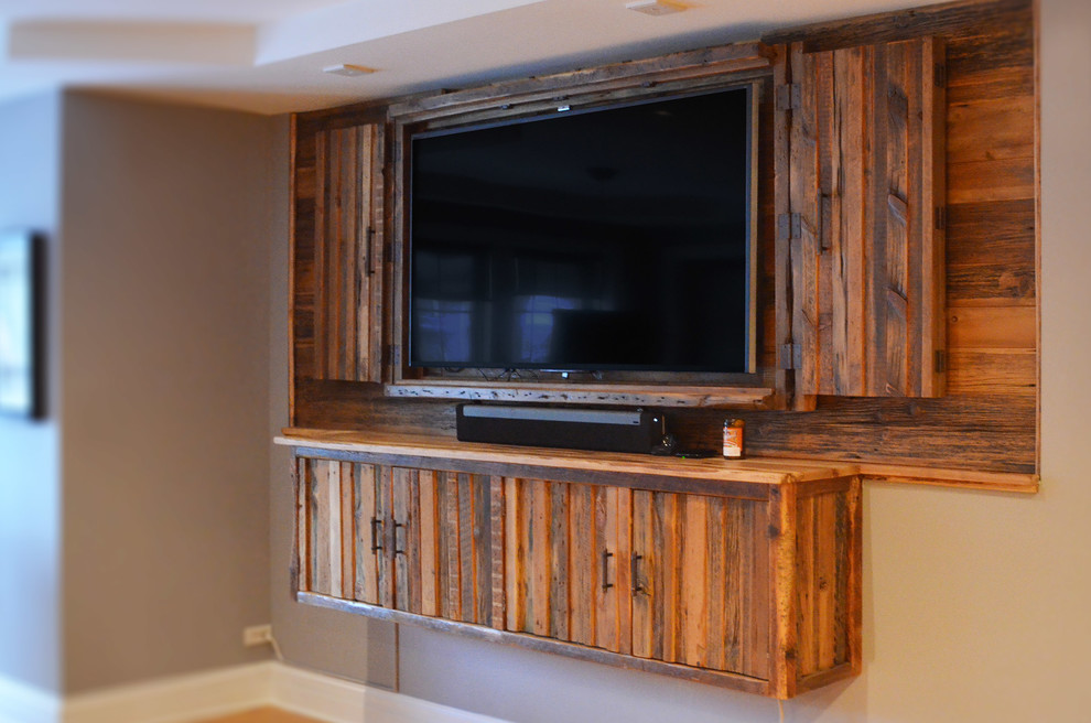 Inspiration for a large rustic enclosed living room in Chicago with a wall mounted tv.