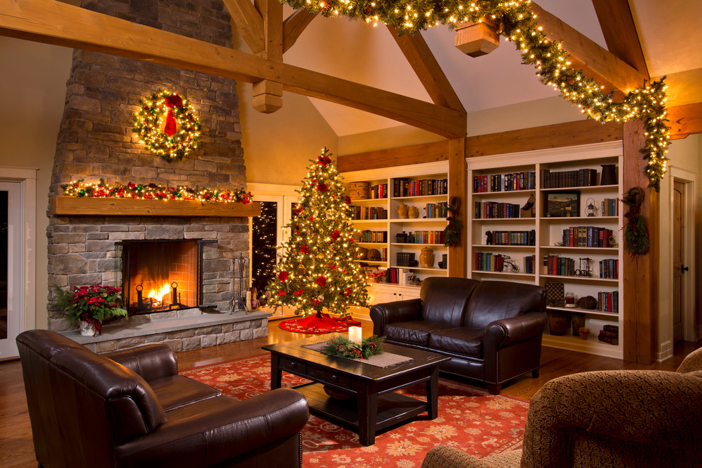 Inspiration for a huge timeless open concept medium tone wood floor living room library remodel in Boston with a standard fireplace, a stone fireplace and beige walls