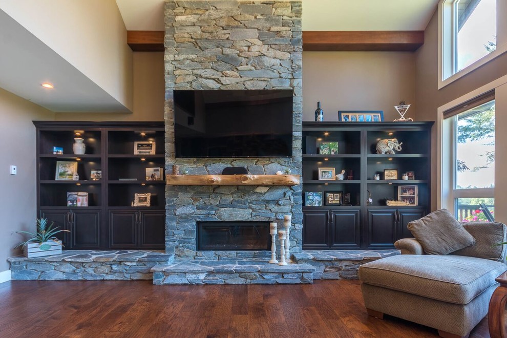 This is an example of a medium sized contemporary open plan living room in Vancouver with brown walls, medium hardwood flooring, a ribbon fireplace, a stone fireplace surround and a wall mounted tv.