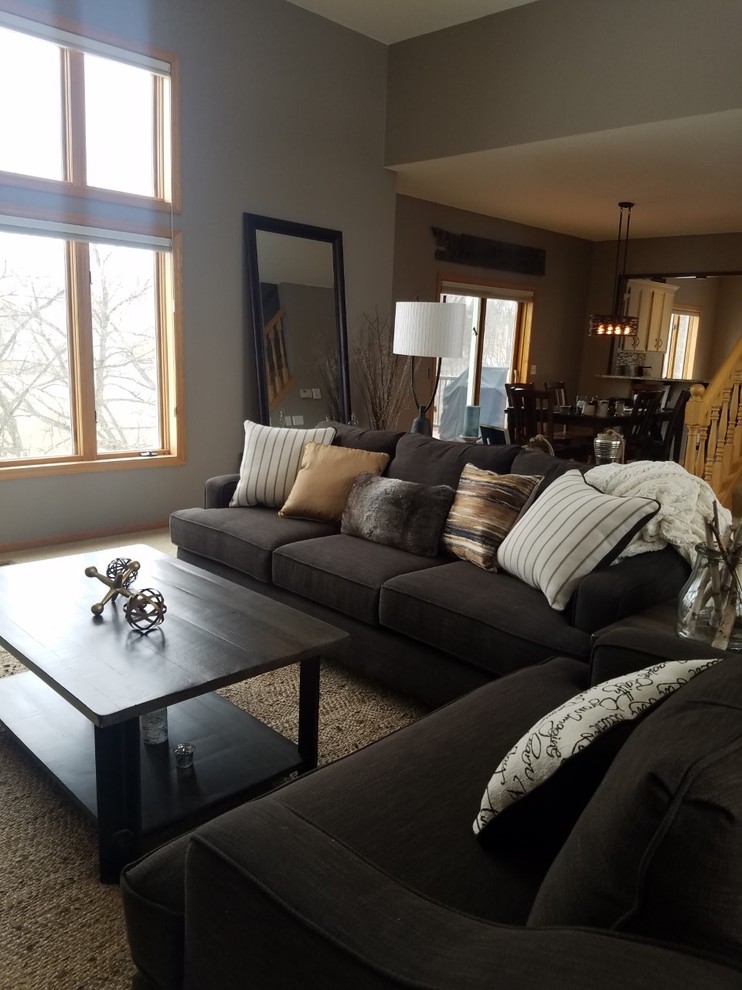 Example of a mid-sized mountain style open concept carpeted and beige floor living room design in Minneapolis with gray walls, a standard fireplace and a tile fireplace