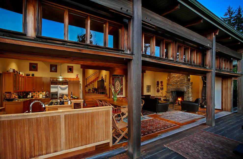 Inspiration for a rustic open plan living room in Seattle with yellow walls.