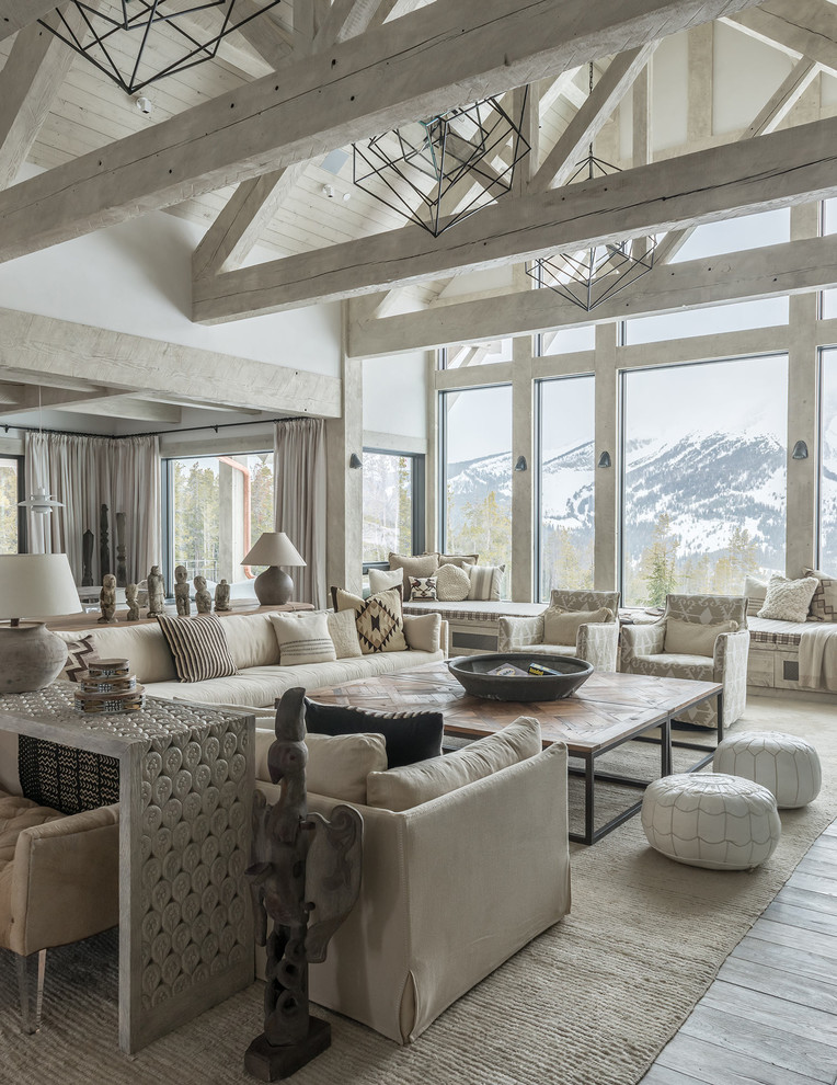 Mountain style formal and open concept light wood floor and gray floor living room photo in Other with white walls