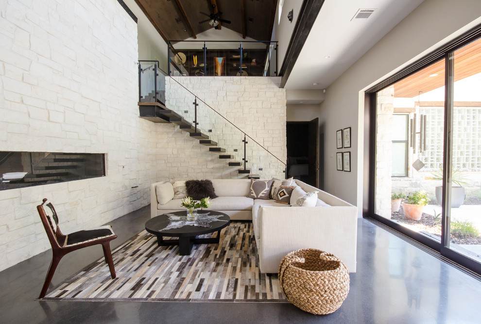 This is an example of a contemporary living room in Houston.