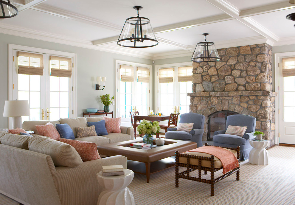 Inspiration for a timeless living room remodel in New York with gray walls, a standard fireplace and a stone fireplace