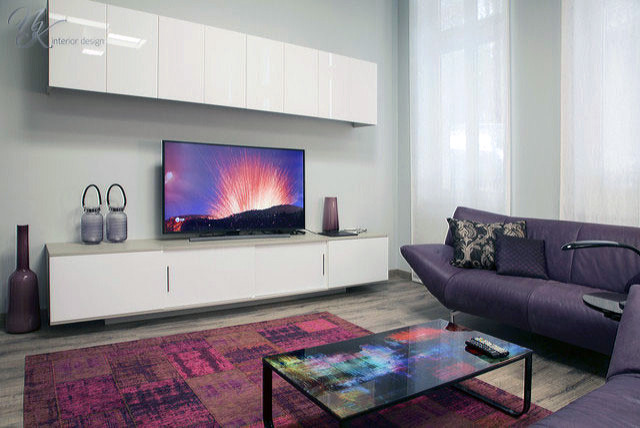 Inspiration for a large modern open plan living room in Other with grey walls, laminate floors and a freestanding tv.