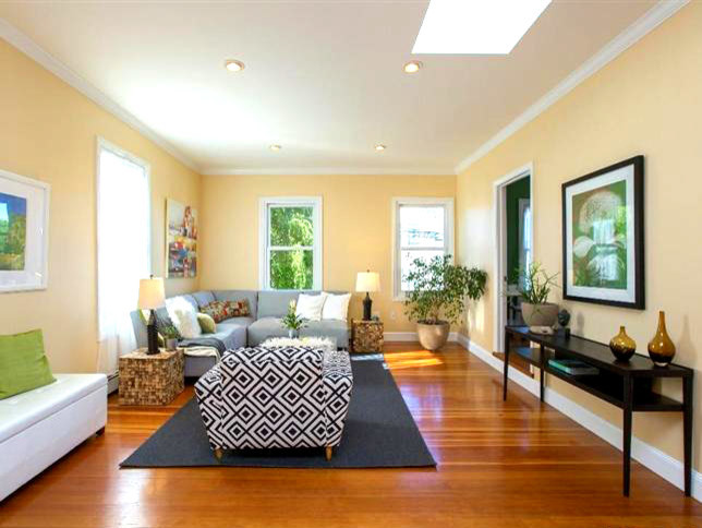 Inspiration for a small transitional light wood floor living room remodel in San Francisco with yellow walls