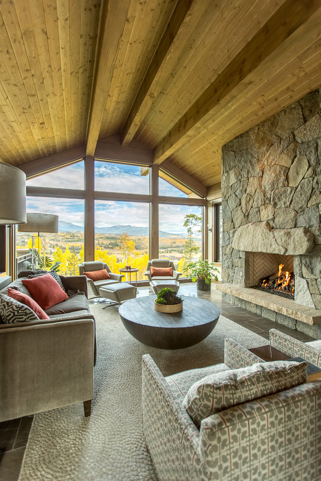 Mountain style living room photo in Denver with a standard fireplace and no tv