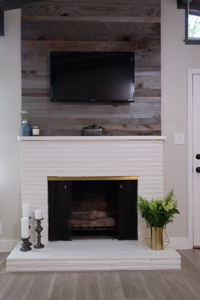 Inspiration for a small contemporary open plan living room in New York with grey walls, medium hardwood flooring, a standard fireplace, a brick fireplace surround and a wall mounted tv.