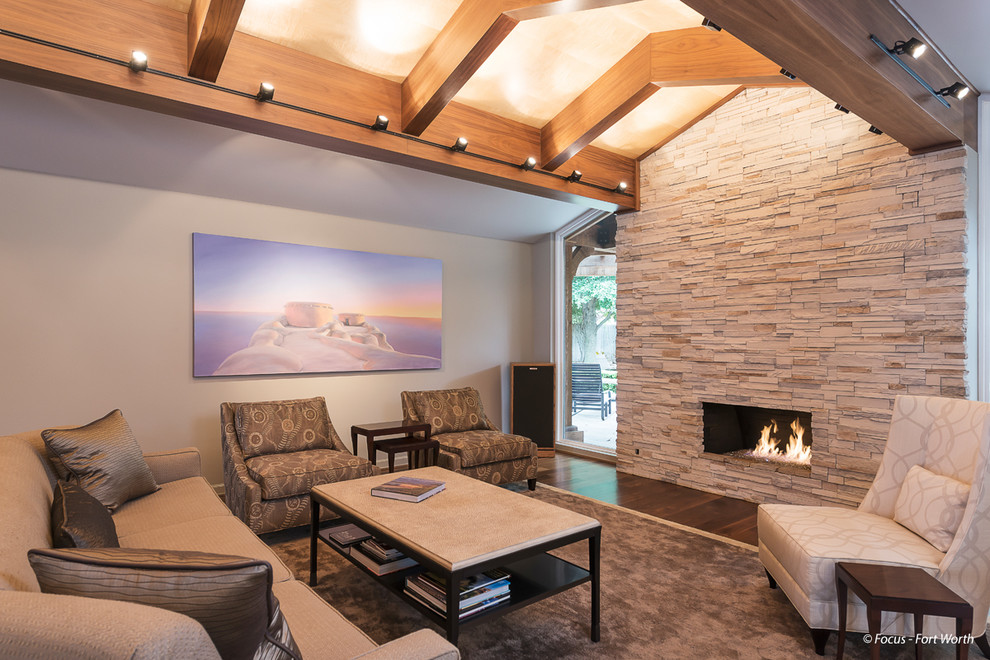 Inspiration for a medium sized traditional open plan living room in Dallas with medium hardwood flooring, a standard fireplace and a stone fireplace surround.