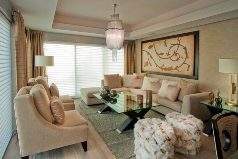 Trendy light wood floor living room photo in Other with beige walls