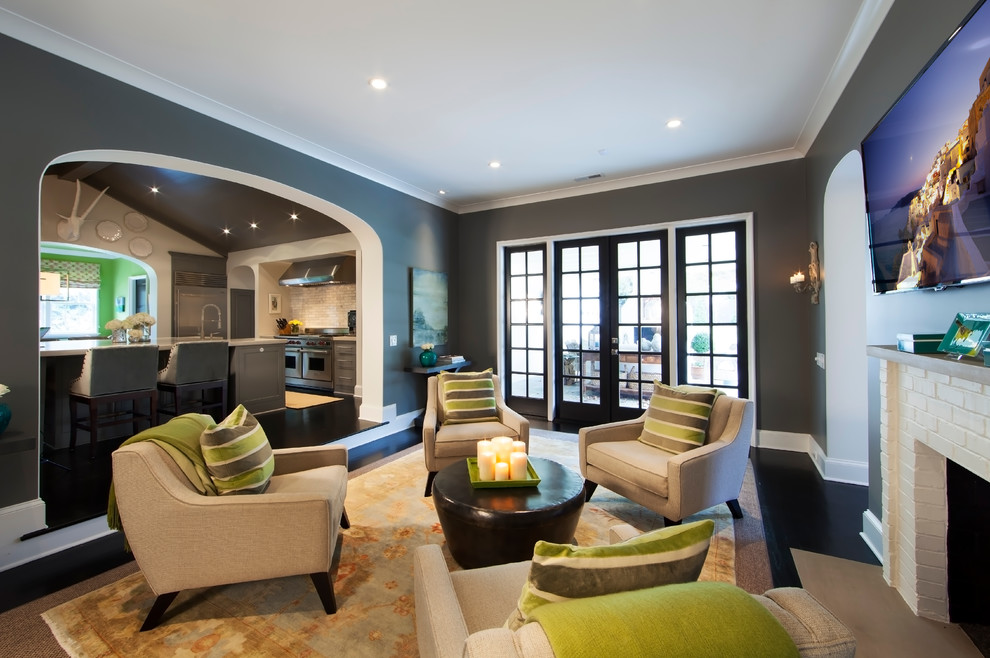 Inspiration for a contemporary black floor living room remodel in Charlotte with black walls, a standard fireplace, a brick fireplace and a wall-mounted tv