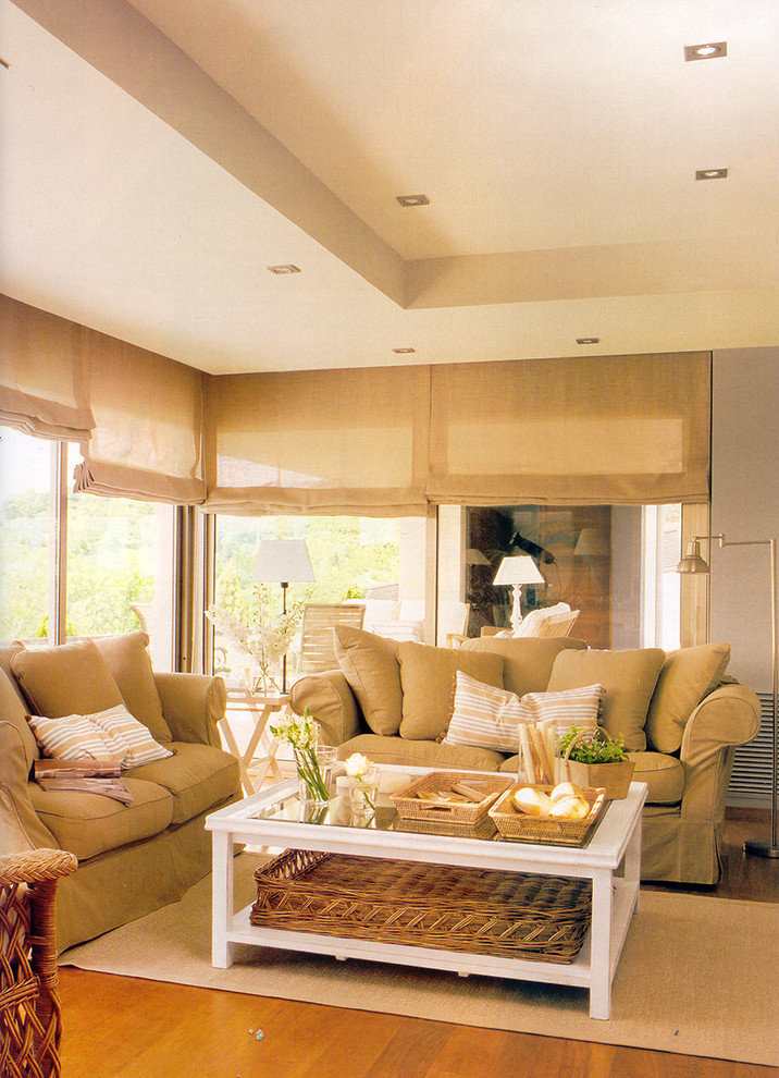 Medium sized mediterranean formal enclosed living room in Madrid with grey walls and medium hardwood flooring.