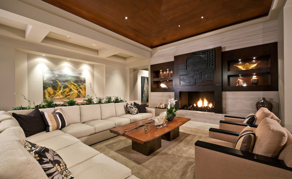Design ideas for an expansive contemporary living room in San Diego with beige walls, a standard fireplace and no tv.