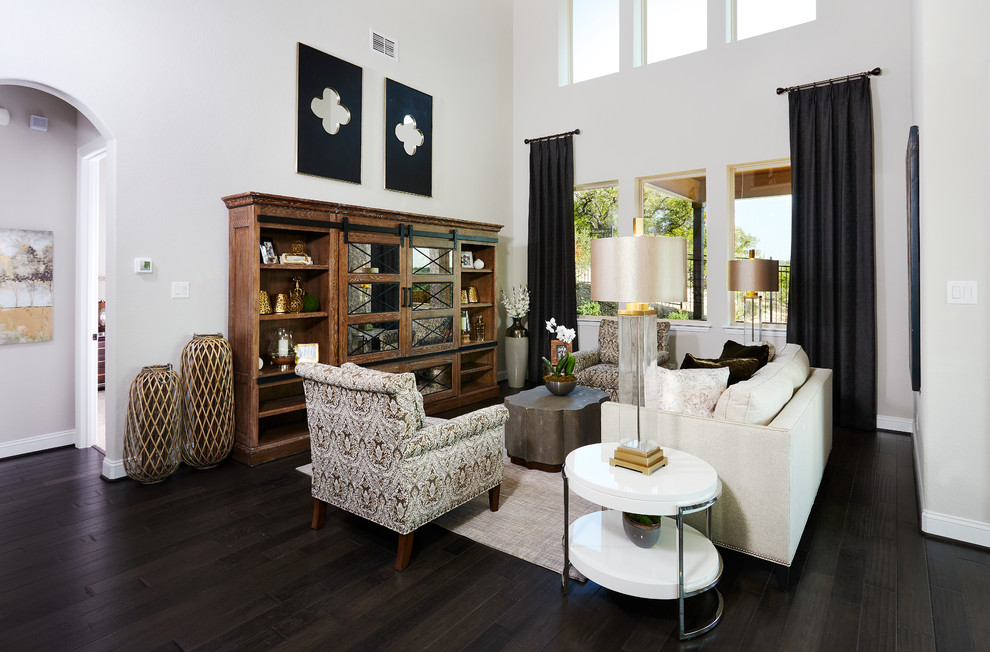 Example of a large mountain style open concept dark wood floor and brown floor living room design in Other with beige walls, no fireplace and a concealed tv