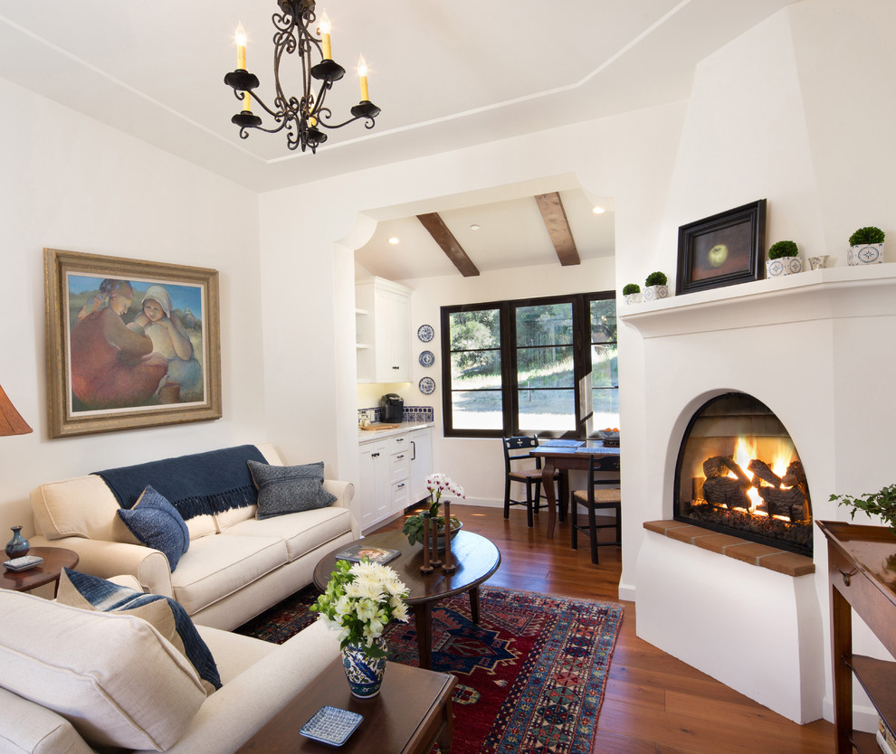 Example of a tuscan dark wood floor living room design in Santa Barbara
