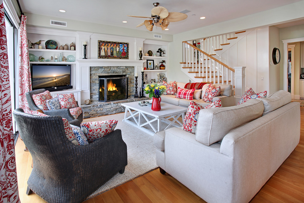 Design ideas for a nautical living room in Orange County with a stone fireplace surround.