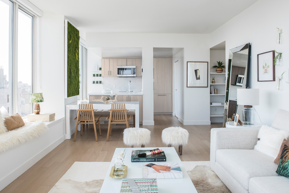 Свежая идея для дизайна: парадная, открытая гостиная комната среднего размера в скандинавском стиле с белыми стенами, светлым паркетным полом и бежевым полом без камина, телевизора - отличное фото интерьера