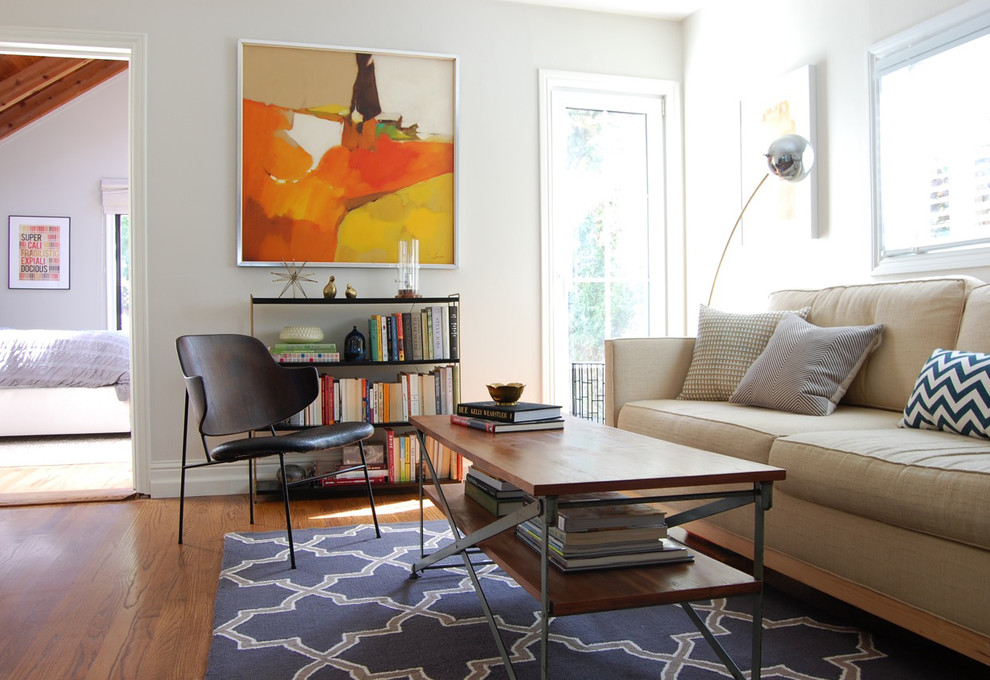 Inspiration for a contemporary medium tone wood floor living room remodel in San Francisco with white walls