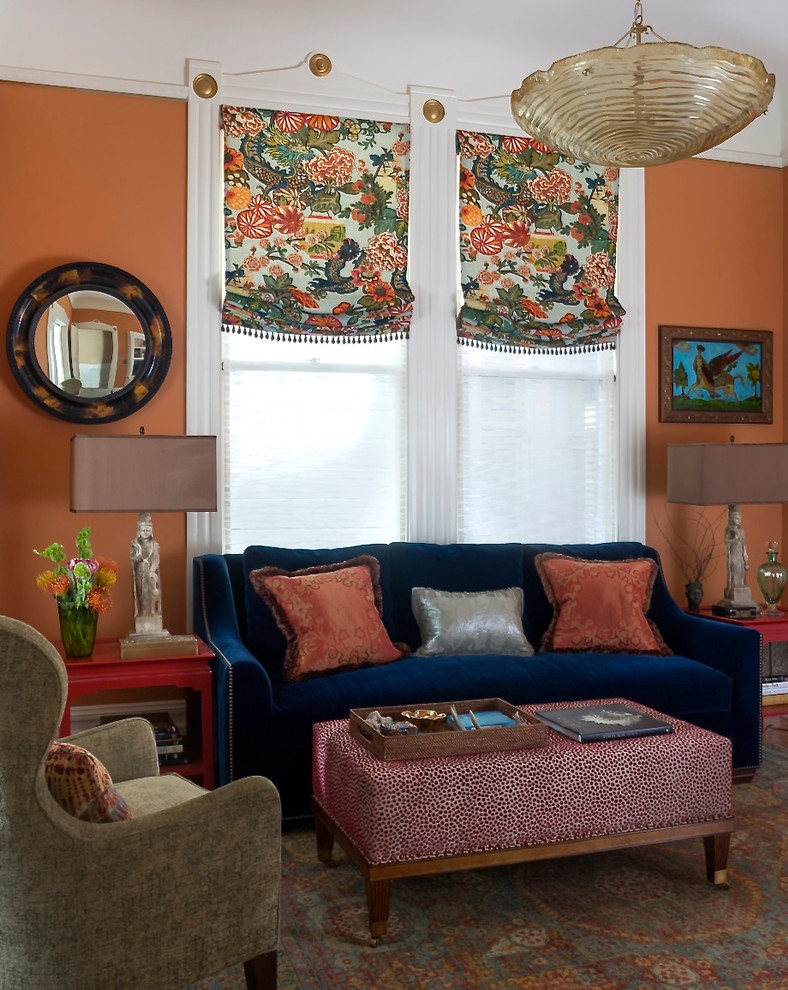 Design ideas for a traditional formal enclosed living room in San Francisco with orange walls, medium hardwood flooring and no tv.