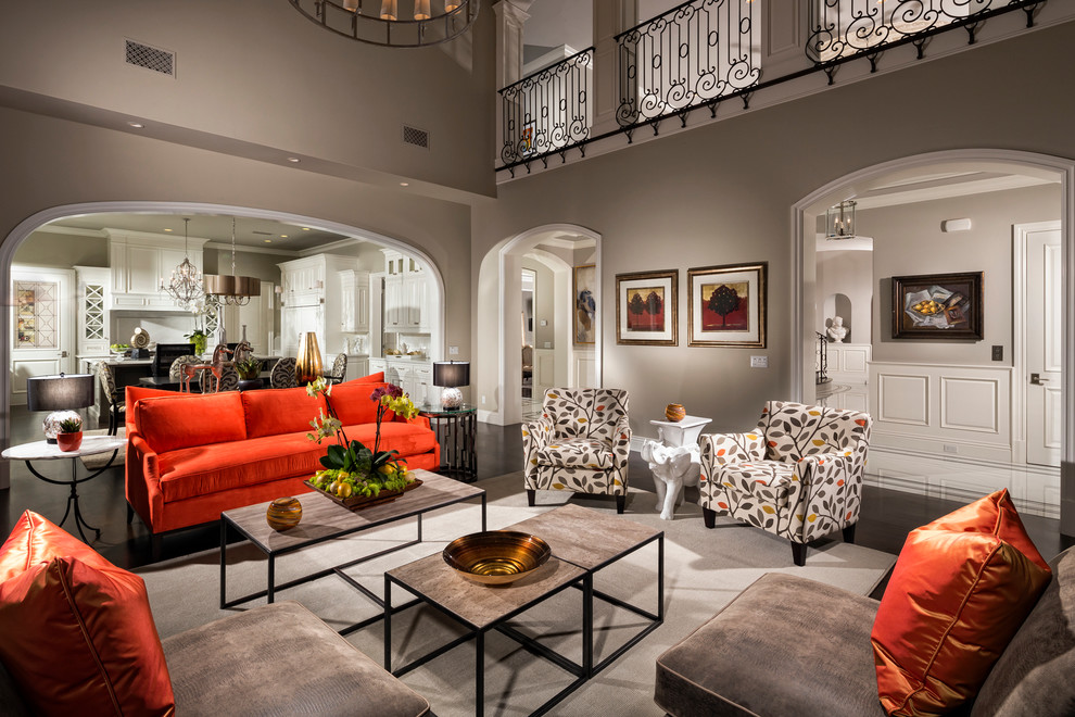 This is an example of a contemporary formal open plan living room in Los Angeles with grey walls and dark hardwood flooring.