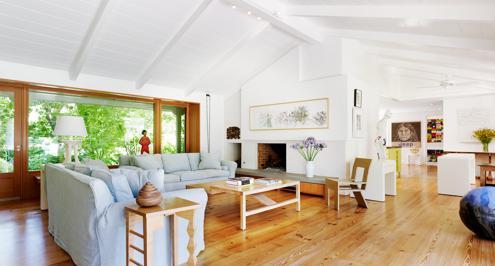 Inspiration for a 1960s light wood floor living room remodel in San Francisco with white walls