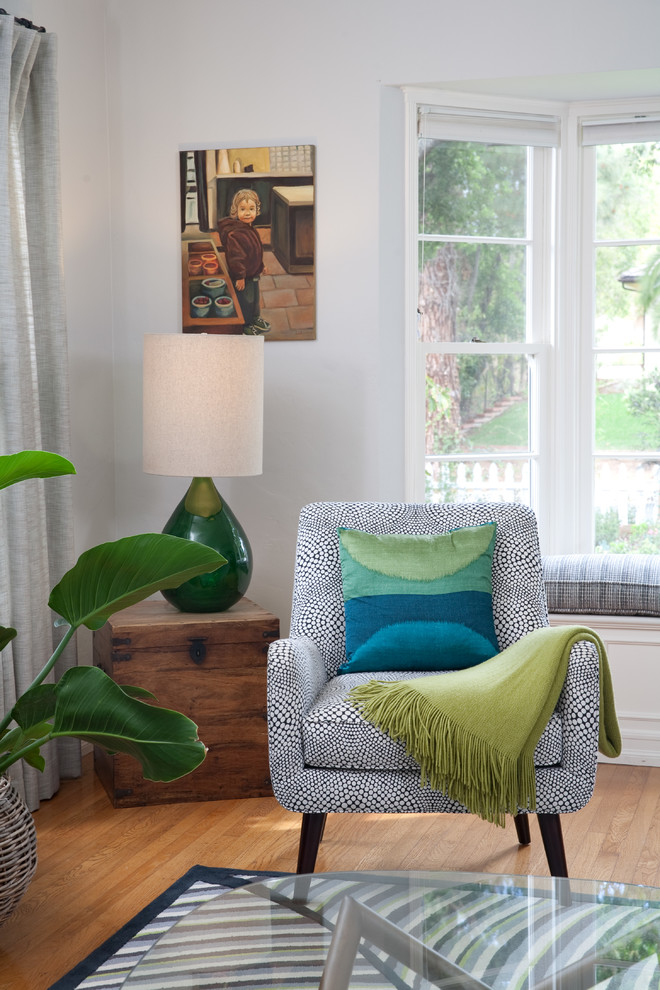 Photo of a large classic enclosed living room in Santa Barbara with grey walls and medium hardwood flooring.