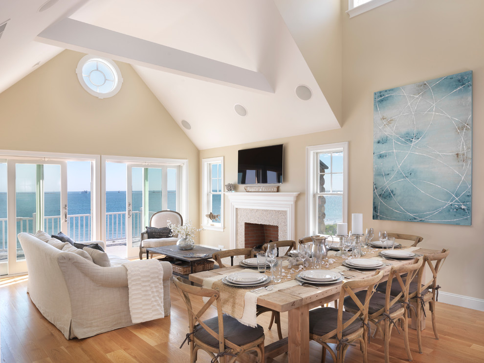 Example of a beach style living room design in Providence with beige walls