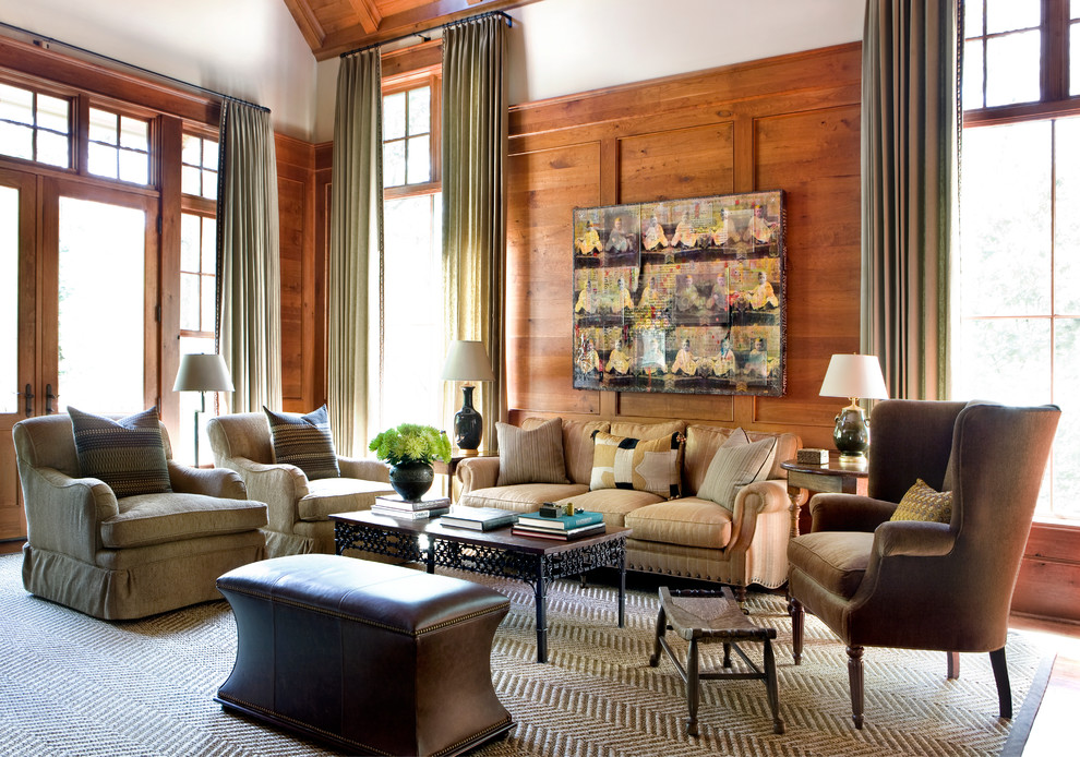 На фото: большая открытая гостиная комната в стиле неоклассика (современная классика) с коричневыми стенами с