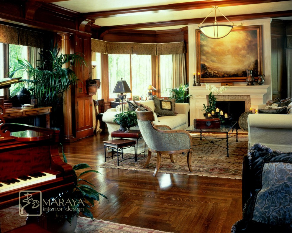 Exemple d'un très grand salon craftsman ouvert avec une salle de réception, un sol en bois brun, une cheminée standard, un manteau de cheminée en pierre, un mur blanc et aucun téléviseur.
