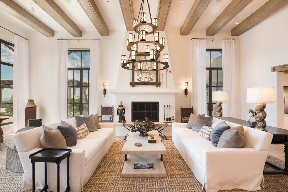 Southwest open concept living room photo in Albuquerque with white walls and a standard fireplace
