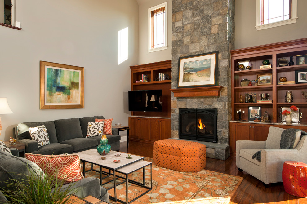 Photo of a large traditional formal enclosed living room in Boston with grey walls, dark hardwood flooring, a standard fireplace, a stone fireplace surround, no tv and brown floors.