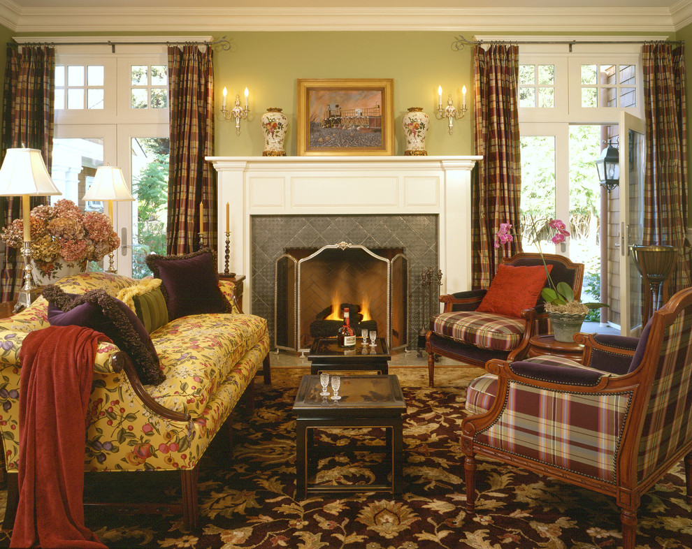 Exemple d'un salon chic avec un sol en bois brun, une cheminée standard, un manteau de cheminée en carrelage, une salle de réception, un mur vert et aucun téléviseur.